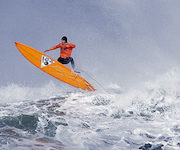 Tyler Fox flies out of a wave during the second heat of the first round of the Mavericks Invitational big wave surf contest Friday, Jan. 24, 2014, in Half Moon Bay, Calif. (AP Photo/Eric Risberg)